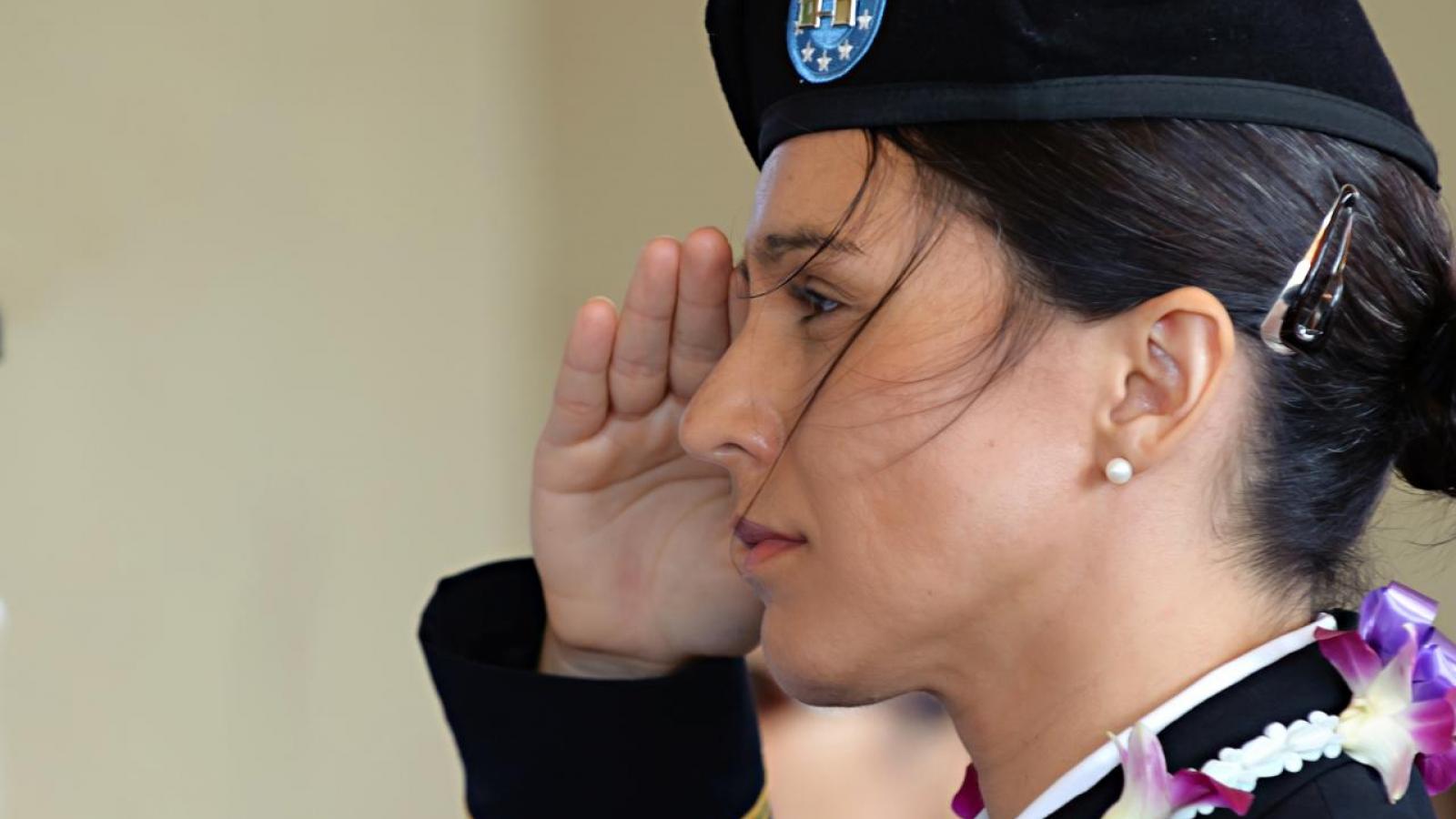 Tulsi Gabbard in uniform, saluting