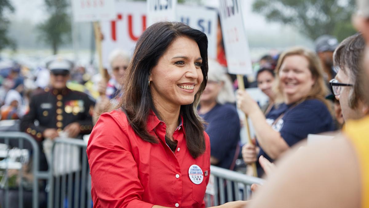 A photo of Tulsi with supporters